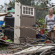 A resident surveys the damage on her property after Hurricane Maria made landfall Sept. 21, 2017, in the Guaynabo suburb of San Juan, Puerto Rico. The majority of the island has lost power, in San Juan, many are left without running water or cellphone service. (Alex Wroblewski/Getty Images)